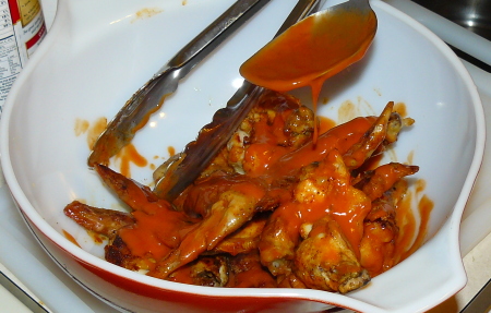 Coat Chicken Wings in Buffalo Sauce